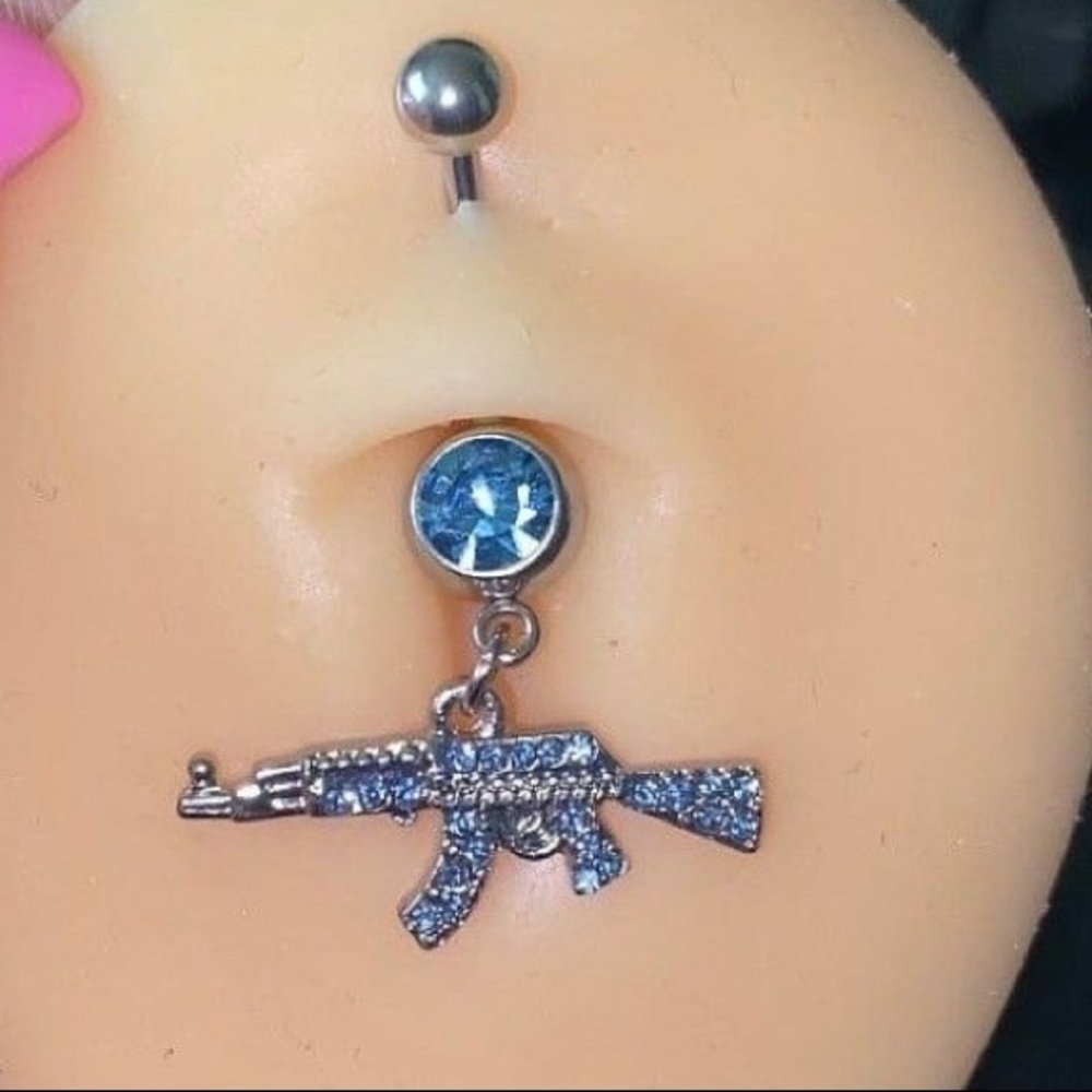 Blue shot gun belly piercing